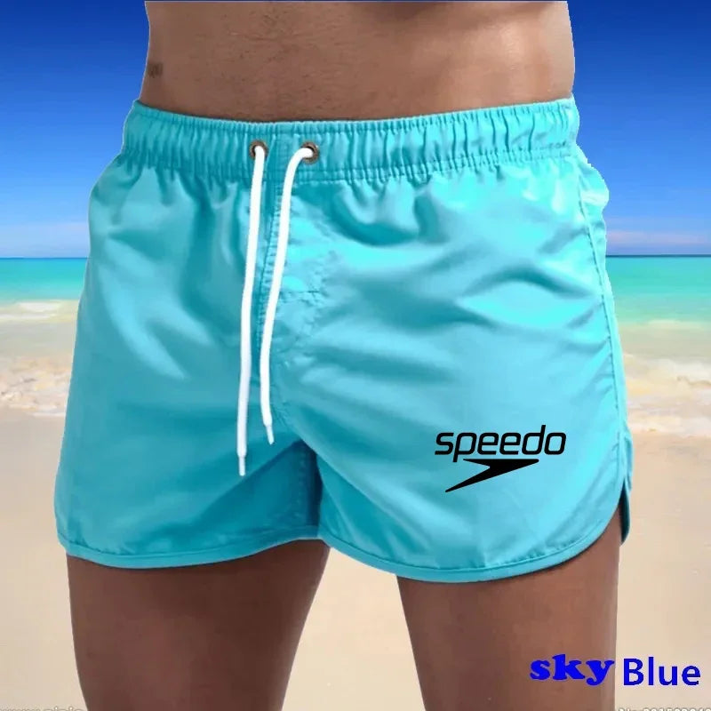 Szexi férfi fürdőruha strand úszónadrág szörfdeszkához