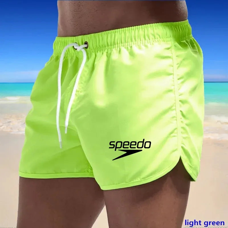 Szexi férfi fürdőruha strand úszónadrág szörfdeszkához
